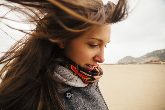 Woman out in windy weather